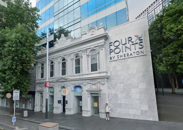 An example of facadism. The facade of a 19th century commercial building attached to a modern glassy structure.